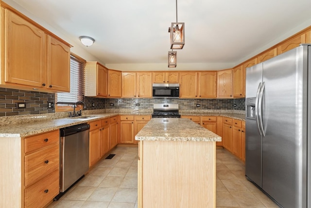 kitchen featuring light tile patterned flooring, a sink, appliances with stainless steel finishes, backsplash, and a center island