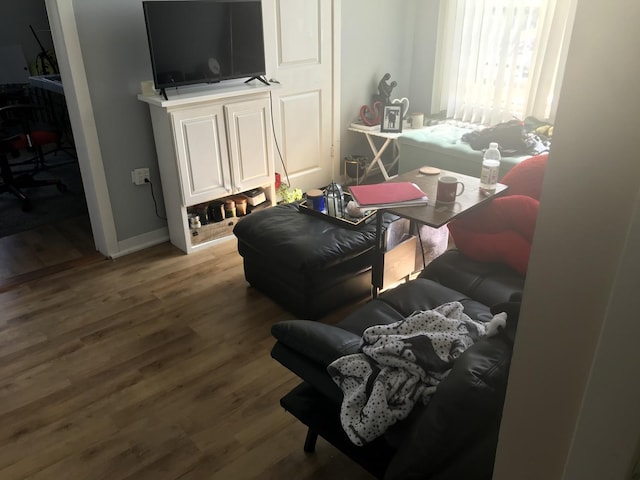 living room with wood finished floors and baseboards