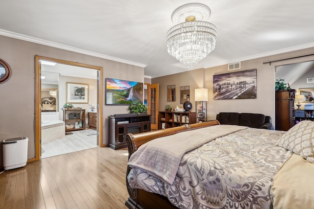 bedroom with wood finished floors, visible vents, ensuite bath, ornamental molding, and a chandelier