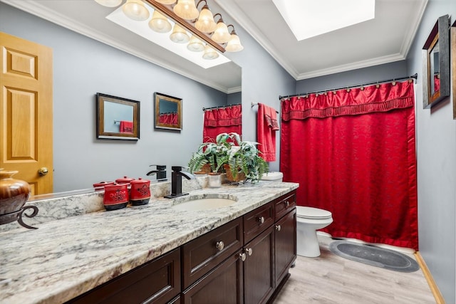 bathroom featuring vanity, wood finished floors, ornamental molding, curtained shower, and toilet