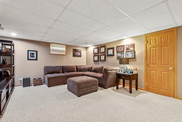 carpeted living area featuring a paneled ceiling, visible vents, baseboards, and recessed lighting