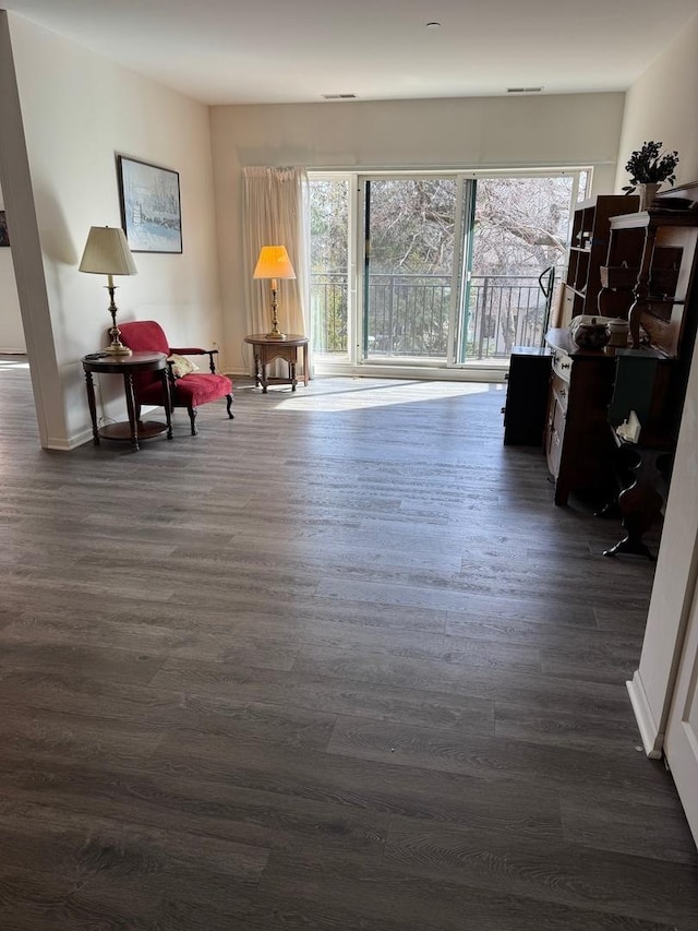 living area featuring dark wood-style floors