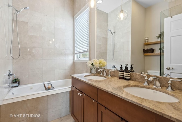 full bath with double vanity, tiled shower / bath combo, and a sink