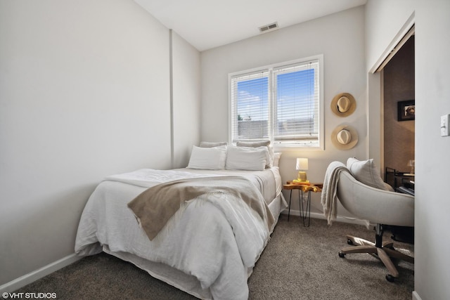 bedroom with baseboards, visible vents, and carpet floors