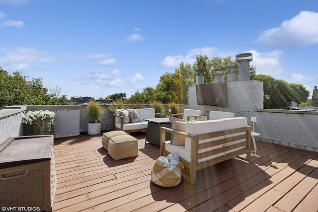 wooden terrace featuring an outdoor living space