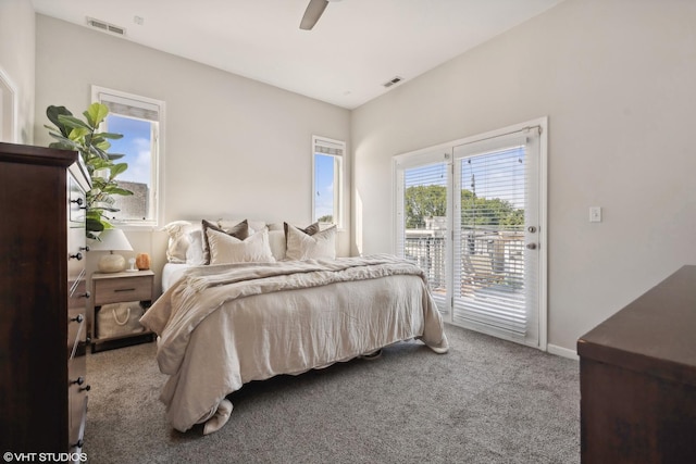 bedroom with visible vents, baseboards, carpet, and access to exterior