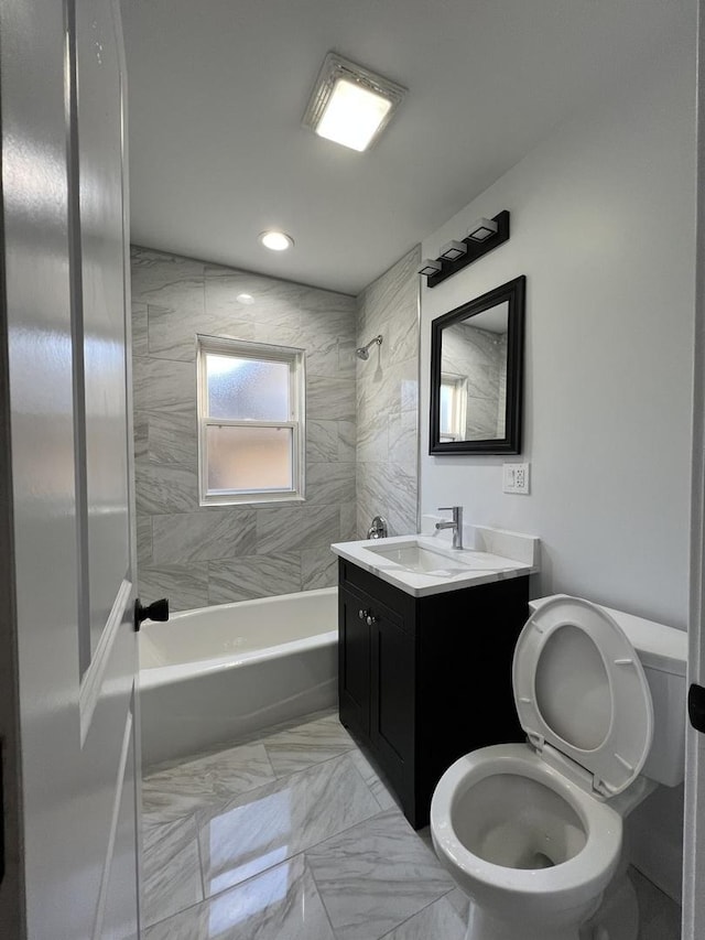 full bath with toilet, marble finish floor, recessed lighting, tub / shower combination, and vanity