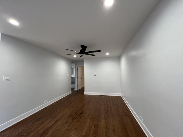 unfurnished room featuring a ceiling fan, recessed lighting, dark wood-style floors, and baseboards