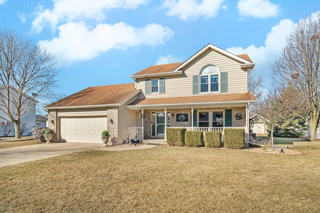 traditional-style house featuring a front lawn, a porch, concrete driveway, an attached garage, and brick siding