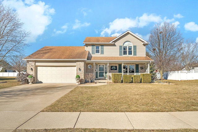 traditional-style house with fence, driveway, covered porch, a front lawn, and brick siding