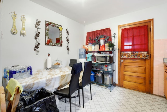 dining area featuring light floors