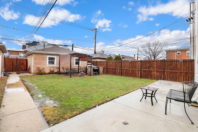 view of yard featuring a patio, fence, and an outdoor fire pit