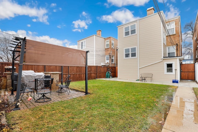 view of yard with a fenced backyard and a patio