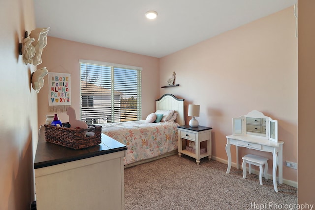 bedroom with baseboards and carpet flooring