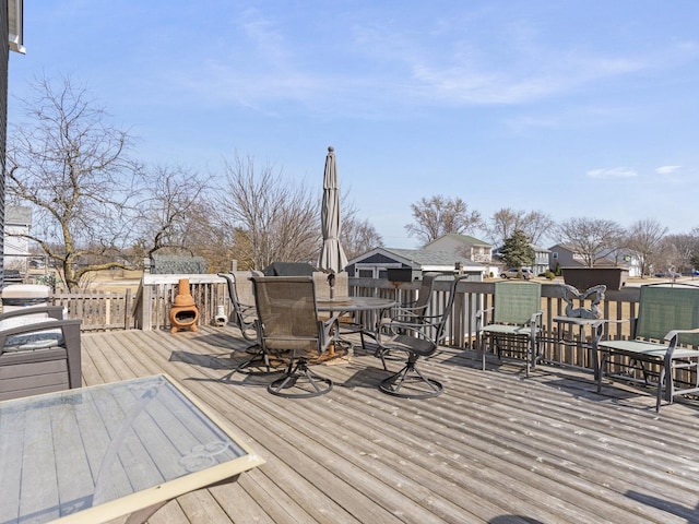 wooden terrace with outdoor dining area