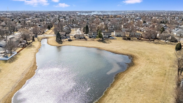 drone / aerial view with a residential view and a water view