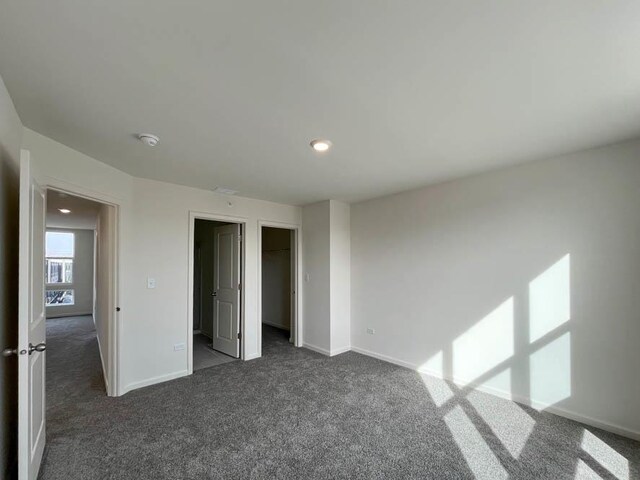 sitting room featuring visible vents, baseboards, and carpet