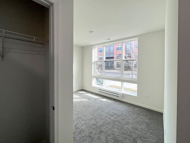 carpeted bedroom featuring baseboards