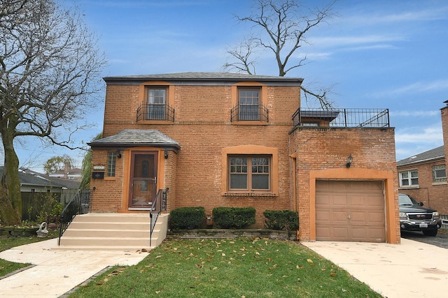 traditional-style house featuring concrete driveway, a balcony, a garage, and brick siding