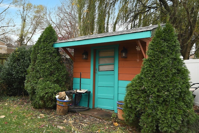 view of outbuilding with fence