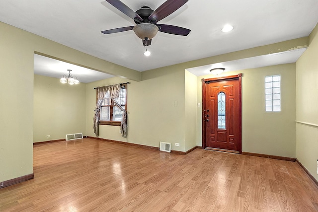 entryway with visible vents, baseboards, and light wood finished floors