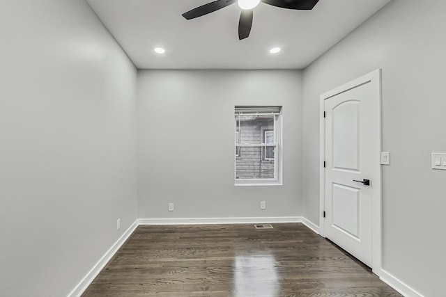 unfurnished room featuring dark wood-style floors, visible vents, baseboards, recessed lighting, and ceiling fan