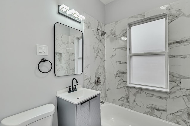 bathroom with vanity, toilet, and shower / bathtub combination