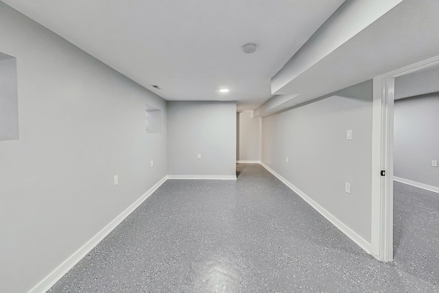 finished basement featuring baseboards