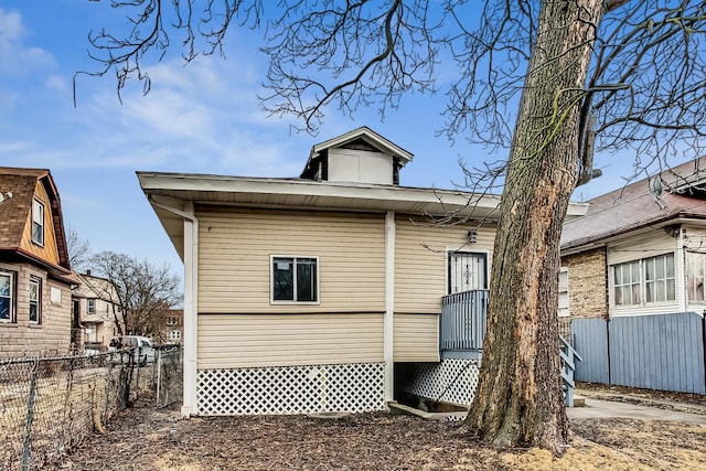 back of property with fence