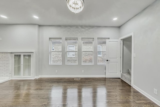 interior space featuring recessed lighting, wood finished floors, and baseboards