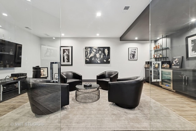 living room with visible vents, a bar, recessed lighting, and wood tiled floor