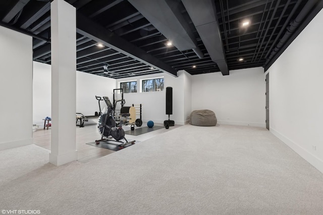 exercise area with baseboards and carpet