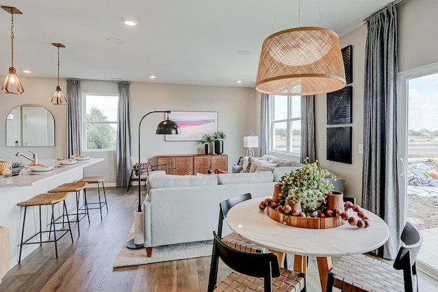 dining area with plenty of natural light, recessed lighting, and light wood finished floors