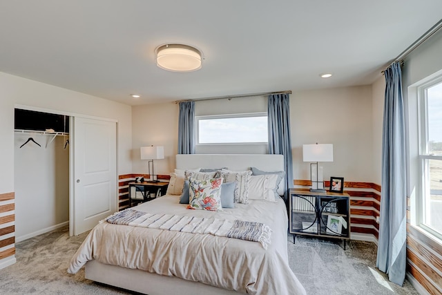 carpeted bedroom with recessed lighting and a closet