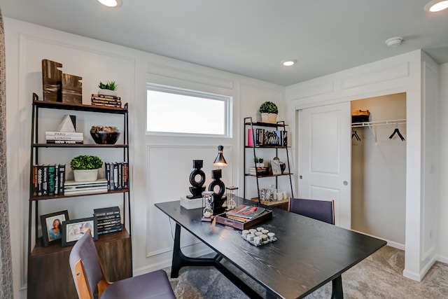 home office with a decorative wall and recessed lighting