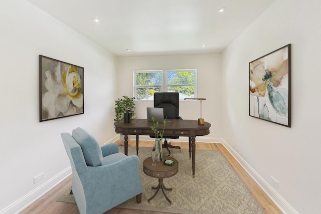 office with wood finished floors and baseboards