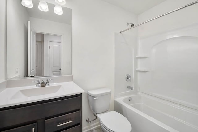 bathroom with toilet, vanity, and bathtub / shower combination