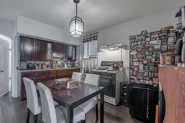 dining space featuring dark wood-type flooring