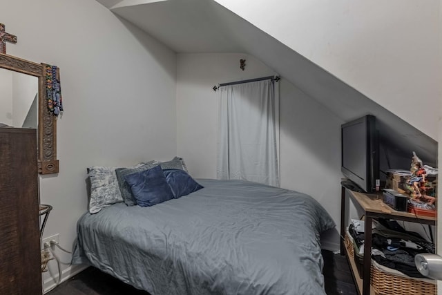 bedroom featuring lofted ceiling