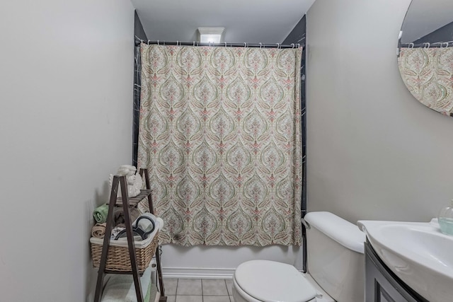 bathroom with vanity, tile patterned floors, and toilet