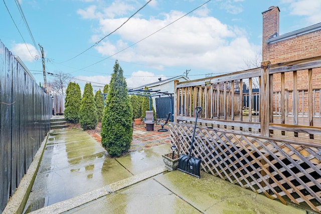 view of patio / terrace featuring fence