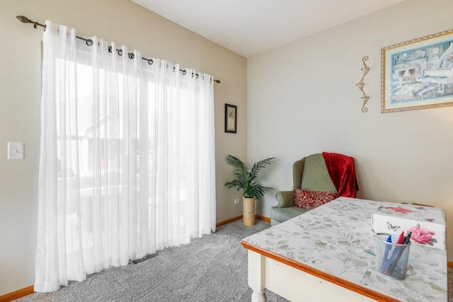 carpeted bedroom featuring visible vents and baseboards