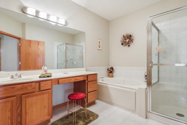 full bathroom with a bath, tile patterned floors, a stall shower, and vanity