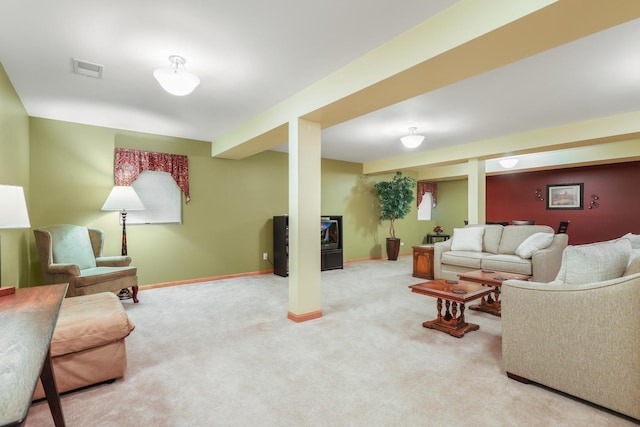 carpeted living area with baseboards and visible vents