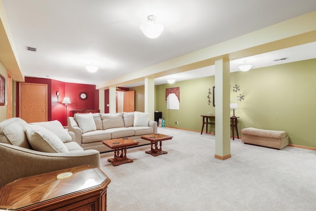 carpeted living area with baseboards and visible vents