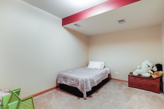 carpeted bedroom with baseboards and visible vents