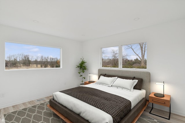 41660 N Hunt Club Rd, Old Mill Creek, IL 60083 - bedroom featuring baseboards, visible vents, and wood finished floors