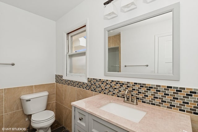 41660 N Hunt Club Rd, Old Mill Creek, IL 60083 - bathroom featuring tile walls, wainscoting, toilet, and vanity