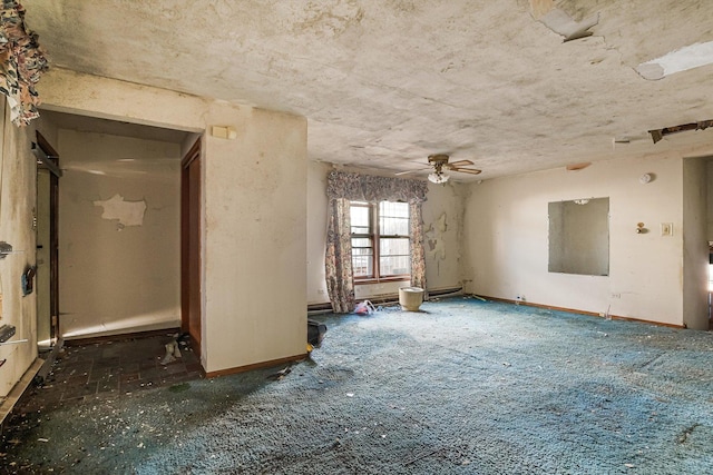 empty room featuring a ceiling fan and baseboards