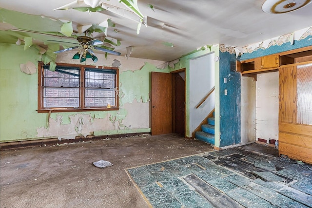 interior space featuring stairway and ceiling fan